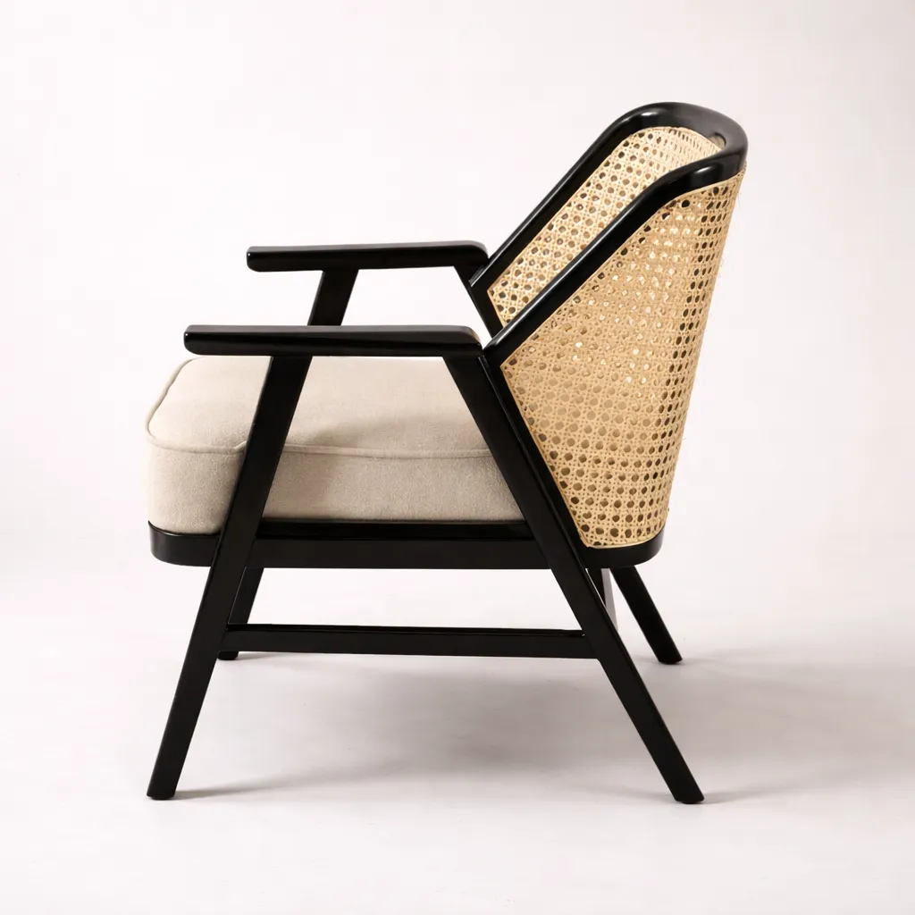 MONA RATTAN ACCENT TEAK CHAIR Side Angle.webp