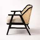 MONA RATTAN ACCENT TEAK CHAIR Side Angle.webp